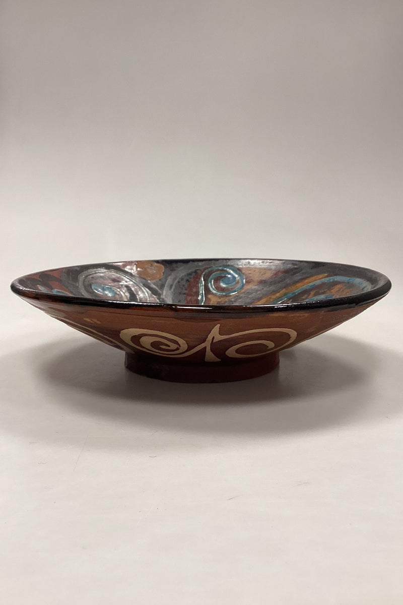 Stoneware bowl in shades of brown, yellow and blue
