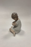Royal Copenhagen Figur Pige med Dukke No. 1938
