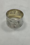 Silver napkin ring with horses and riders