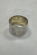 Silver napkin ring with horses and riders