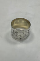 Silver napkin ring with horses and riders