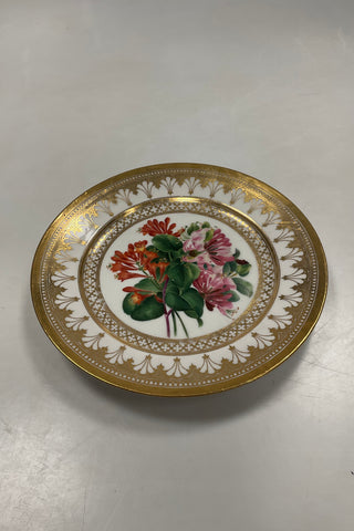 Royal Copenhagen Antique Plate with Floral Motif and gold. Signed by Christian Klein from 1820-1850