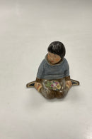 Royal Copenhagen Figur i Overglasur - Dreng med blomster fra Grønland No. 12419.