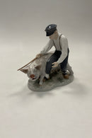 Royal Copenhagen Figurine Pig boy with pig No. 848