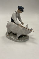 Royal Copenhagen Figurine Pig boy with pig No. 848