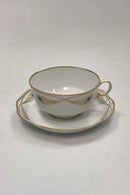 Royal Copenhagen Stel No. 118/2007 Tekop med Underkop Påfugl med Guldkant