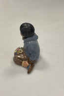 Royal Copenhagen Figur i Overglasur - Dreng med blomster fra Grønland No. 12419