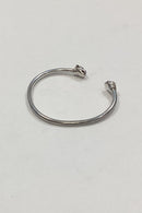Modern open bangle in Sterling Silver with lion heads