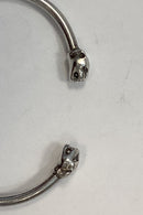 Modern open bangle in Sterling Silver with lion heads