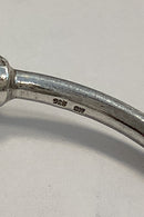 Modern open bangle in Sterling Silver with lion heads