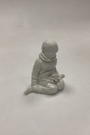 Royal Copenhagen Blanc de Chine Figurine - Boy with flowers from Greenland No. 12419