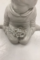 Royal Copenhagen Blanc de Chine Figurine - Boy with flowers from Greenland No. 12419