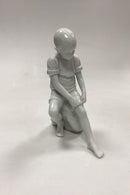 Royal Copenhagen Blanc de Chine Figur - Dreng på Sten No. 520