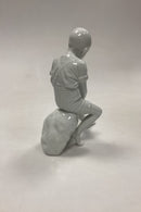 Royal Copenhagen Blanc de Chine Figur - Dreng på Sten No. 520