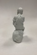 Royal Copenhagen Blanc de Chine Figur - Dreng på Sten No. 520