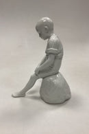 Royal Copenhagen Blanc de Chine Figur - Dreng på Sten No. 520