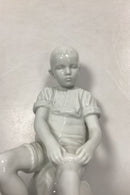 Royal Copenhagen Blanc de Chine Figur - Dreng på Sten No. 520