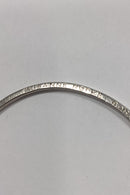 Silver bangle with ball pendant and engraving