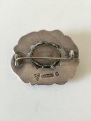 Thorvald Bindesbøll broche fra Holger Kysters Værksted med Sten