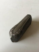Georg Jensen Lily of the Valley paperweight in steel. A press for a knife handle.