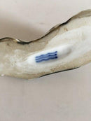 Royal Copenhagen Stentøjs Figur af Lille liggende Budda Dreng. Prøve Glasur