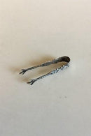 Silberne Zuckerzange