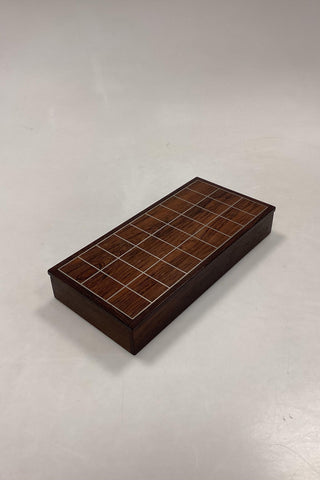 Rosewood box with inlaid metal pattern