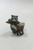 Royal Copenhagen Figurine of Raccoon on tree stump No 054