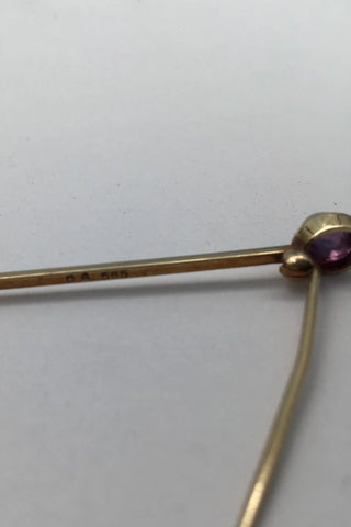 David Andersen 14K Gold Brooch / Tie Pin with Amethyst Measures 4.7 cm (1.85 inch) Weight 2.4 gr. (0.08 oz)