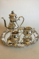 Coffee set in Silver Plater and round Art Nouveau packet in Nickel Silver with grape decoration. Coffee pot, Sugar Bowl and Creamer.