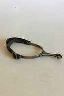 Stirrup with Spur of silver and leather strap.
