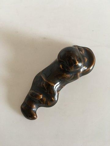 Royal Copenhagen Stentøjs Figur af Lille liggende Budda Dreng. Prøve Glasur