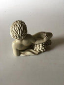 Royal Copenhagen Sjælden figur af nøgen dreng i jern porcelæn