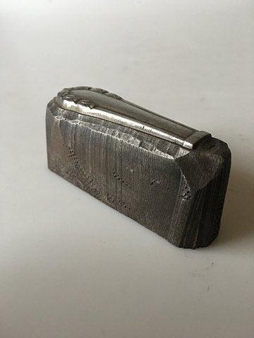Georg Jensen Lily of the Valley paperweight in steel. A press for a knife handle.