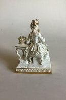 Meissen Figur af siddende dame med blomster