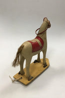 Old toy horse on wheels toy