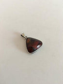 N.E. From Pendent in Silver and Ambor