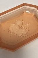 Salt vessel made in light brown glass.