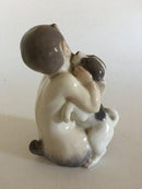 Royal Copenhagen Figur eines Fauns mit Hündchen Nr. 2590
