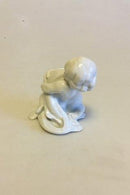 Bing & Grøndahl Blanc de Chine Figur af Havbarn på fisk med fisk i favn No 4038