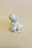 Bing & Grøndahl Blanc de Chine Figur af Havbarn der læner sig op ad fisk No 4037