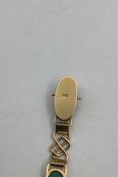 14 karat guld armbånd med grønne sten