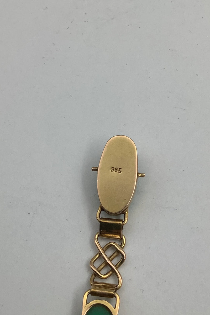 14 karat guld armbånd med grønne sten