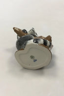 Royal Copenhagen Figurine of Raccoon on tree stump No 054