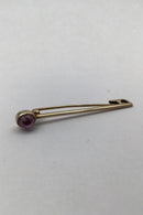 David Andersen 14K Gold Brooch / Tie Pin with Amethyst Measures 4.7 cm (1.85 inch) Weight 2.4 gr. (0.08 oz)