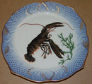 Royal Copenhagen Blaue Fischteller mit Fischrelief am Rand