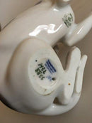 Royal Copenhagen Figur eines liegenden Hundes Nr. 1452/2855