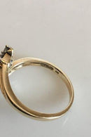 Guldring i 14 K med 16 små sten