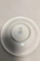 Bing & Grøndahl kop og underkop i guld og polykrom overglasur med blomstermotiv.