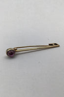 David Andersen 14K Gold Brooch / Tie Pin with Amethyst Measures 4.7 cm (1.85 inch) Weight 2.4 gr. (0.08 oz)